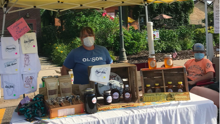 Olson Century Farm with local maple syrup, honey, granola and more at the Annandale Farmers Market in central Minnesota